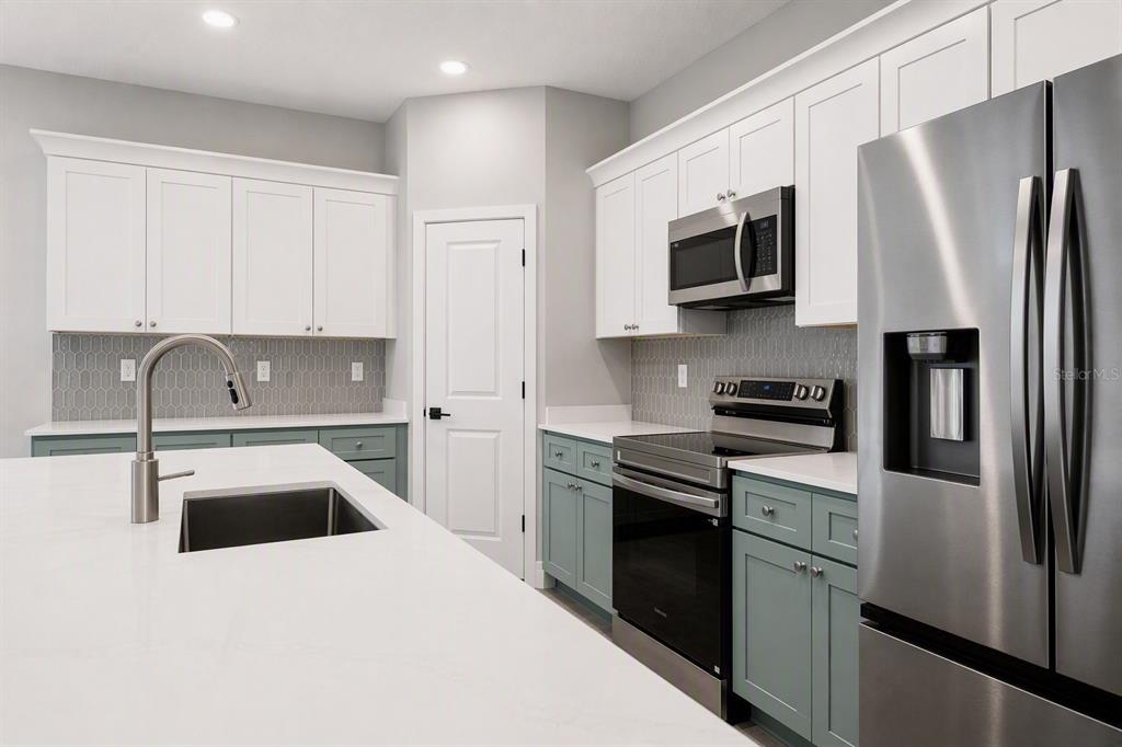 Kitchen.  Colors and finishes may vary.