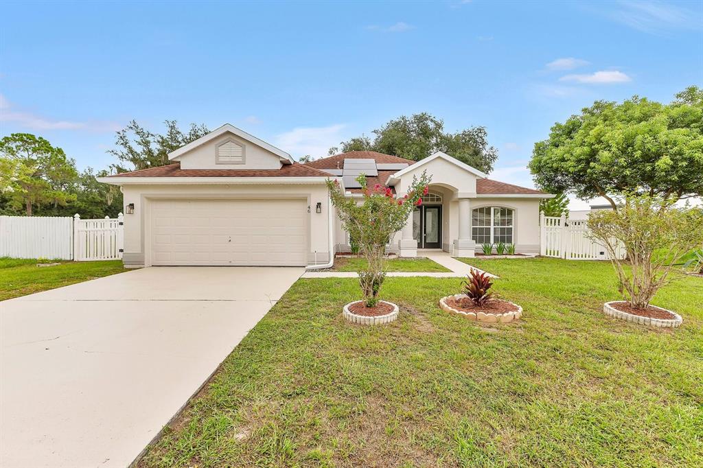 Expansive driveway and front lawn