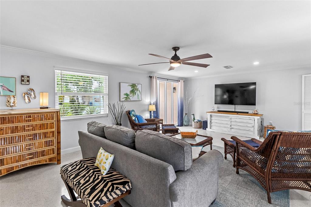 Living room with comfortable seating and coastal furnishings.