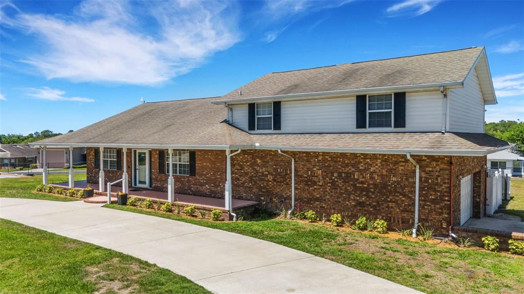 Brick front exterior and wrap-around covered front porch.