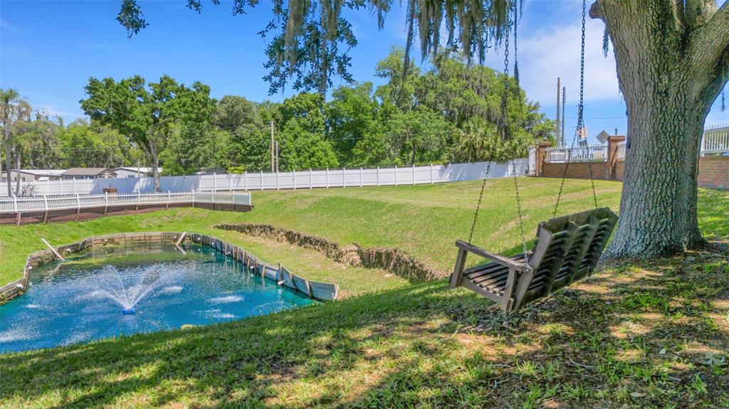 This captivating property sits on 1.32 acres with a sweeping circular driveway and gate entrance.
