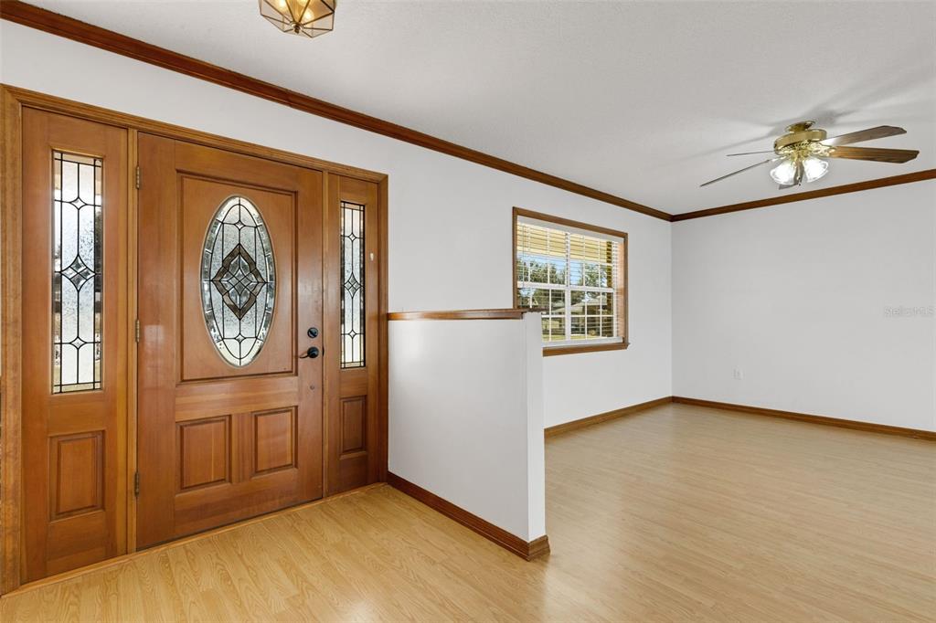 Step inside the custom leaded glass entry door . . .