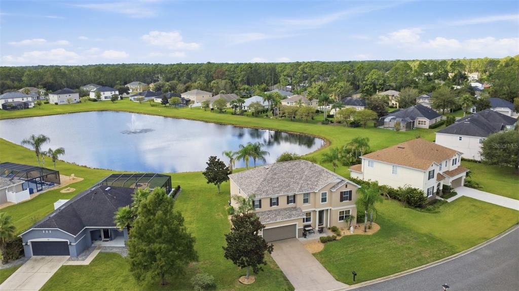 Aerial view of property. NO rear neighbors enjoy the view of the pond.