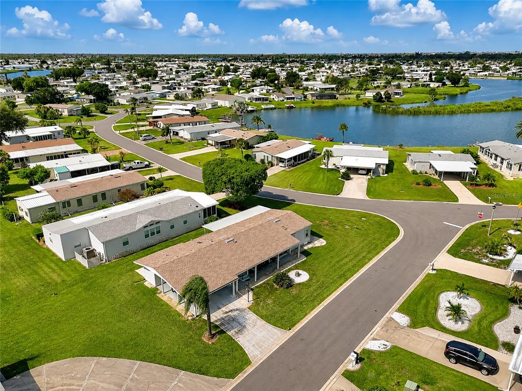 Aerial view of home on a beautiful oversized corner lot
