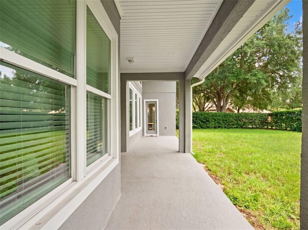 Back patio runs length of the home