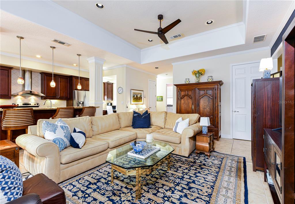 Living room, breakfast bar to the left with open kitchen.