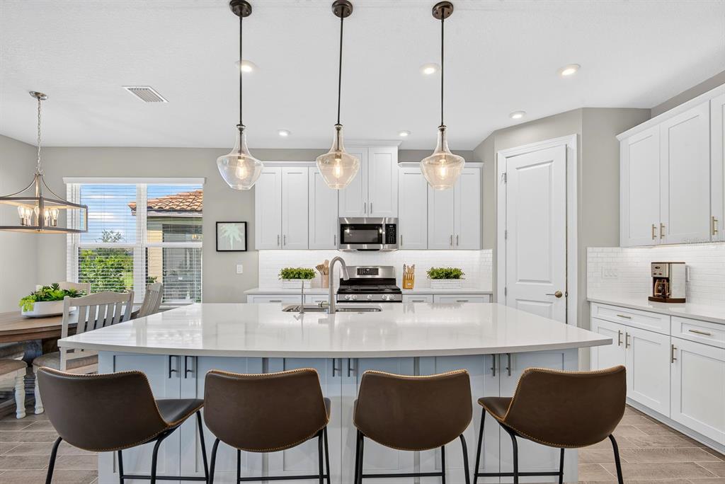 Beautiful kitchen with a large island and base cabinets for extra storage