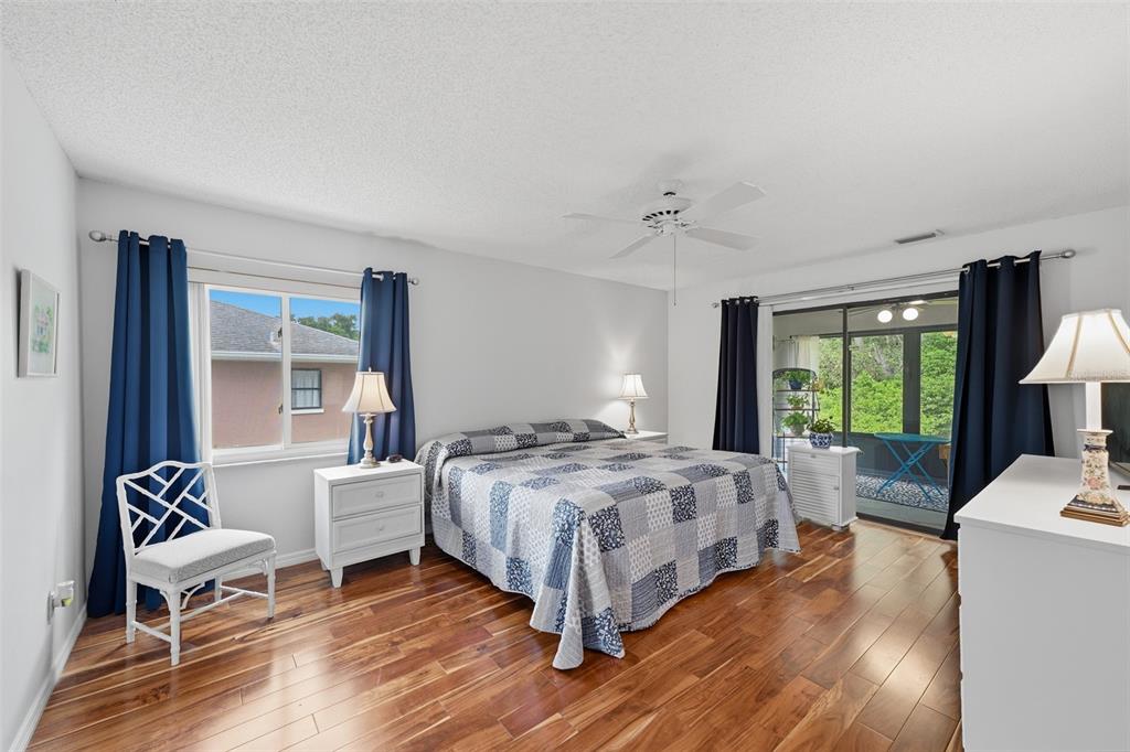 ENJOY THE WOODS VIEW FROM YOUR MAIN BEDROOM.  NEWER ENGINEERED WOOD FLOORING AND WINDOWS.