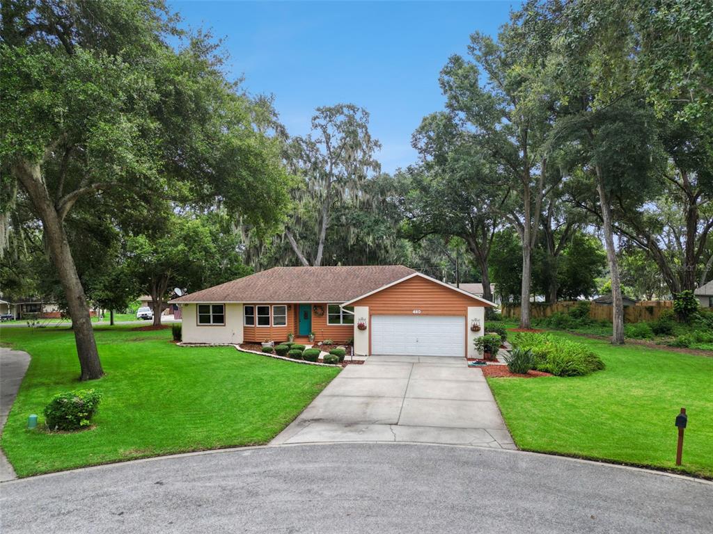 Quiet cul-de-sac setting at 480 Lake Forest Cir with private lot, wide driveway, and established oak canopy in Mount Dora's Lake Forest subdivision