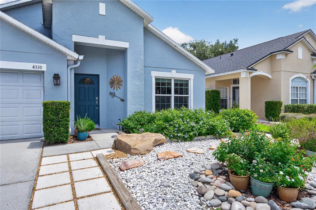 Front of Home With Flowers and Stepping Stones