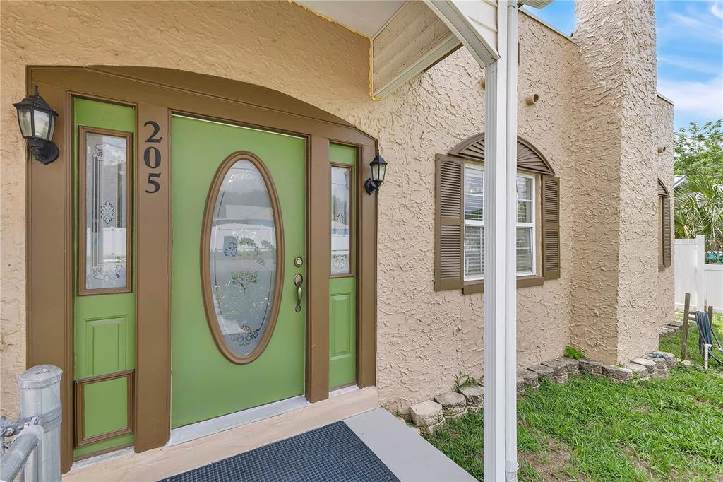 Inviting covered front porch perfect for enjoying the neighborhood.