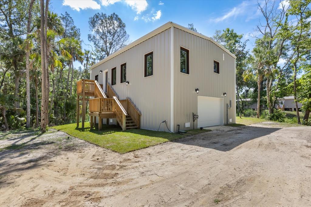 Covered lower level provides exceptional space for boat, golf cart, and vehicle storage.