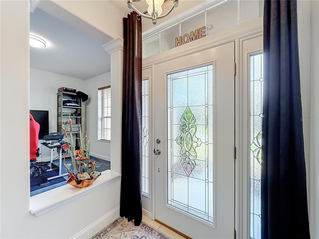 Bright foyer with leaded-glass entry door