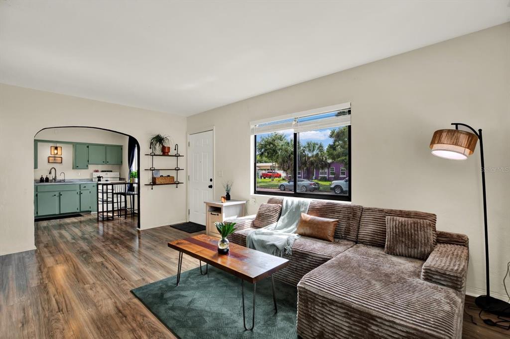 Living room with entrance to kitchen
