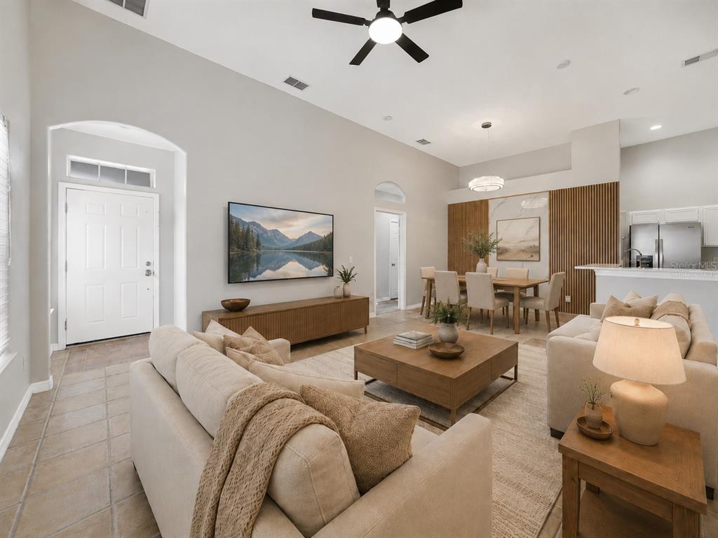 The Living Room boasts great natural light and sleek tile flooring for a fresh, airy feeling. Virtually Staged