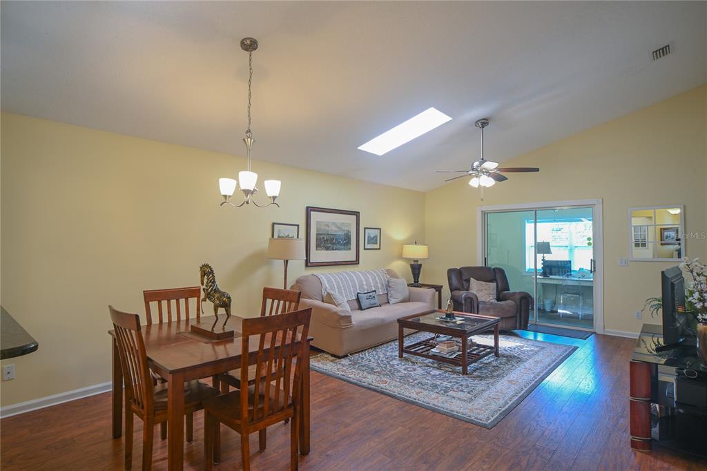 Dining and Living Room with Cathedral Ceiling and Sky Light