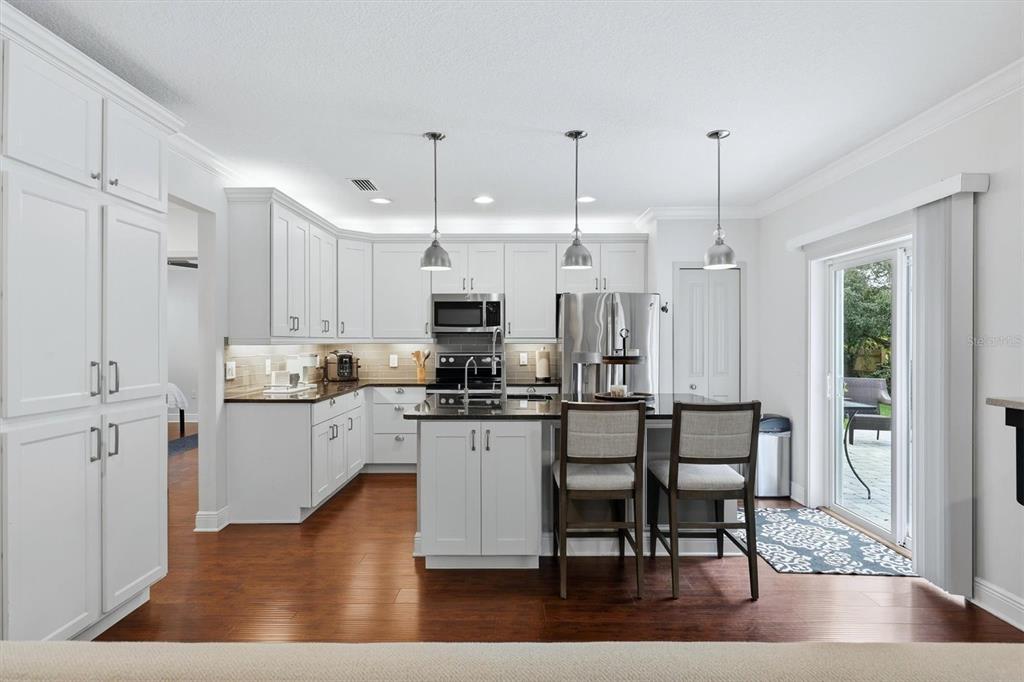 Kitchen with white cabinetry & ample storage