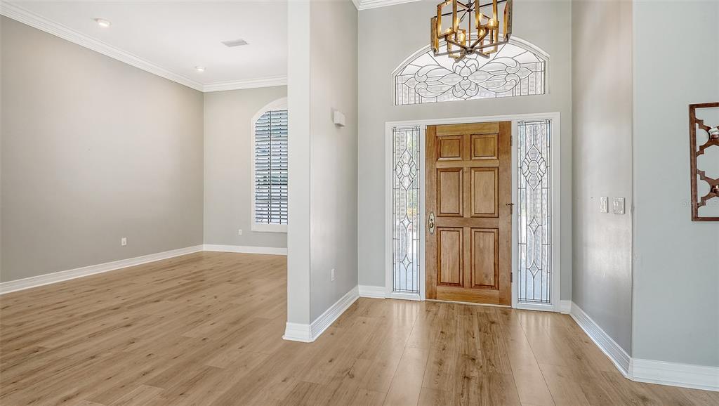 Entry foyer with wood front door
