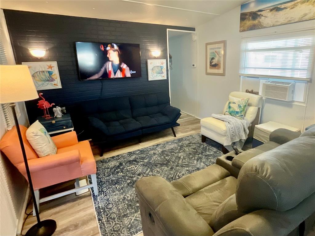 Cozy, cute furniture and furnishings to stay with you including both televisions.