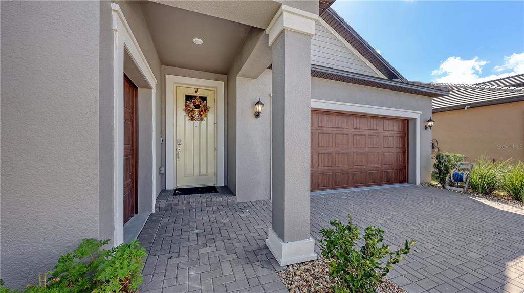 Front Door and 2 Car Garage