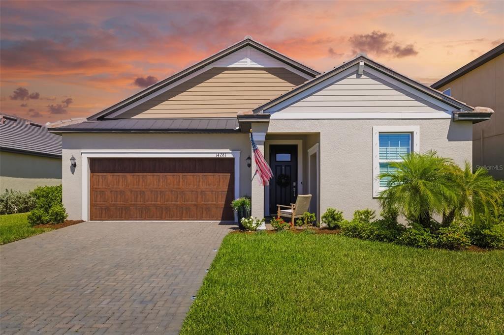 Welcome to 14281 17th Court E in The Enclave at Twin Rivers—gated living with space, privacy, and convenience in Parrish.