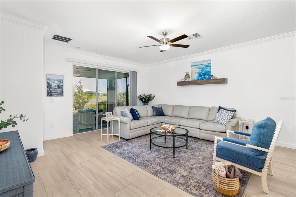 Large family room filled with natural light and views of the private backyard setting.