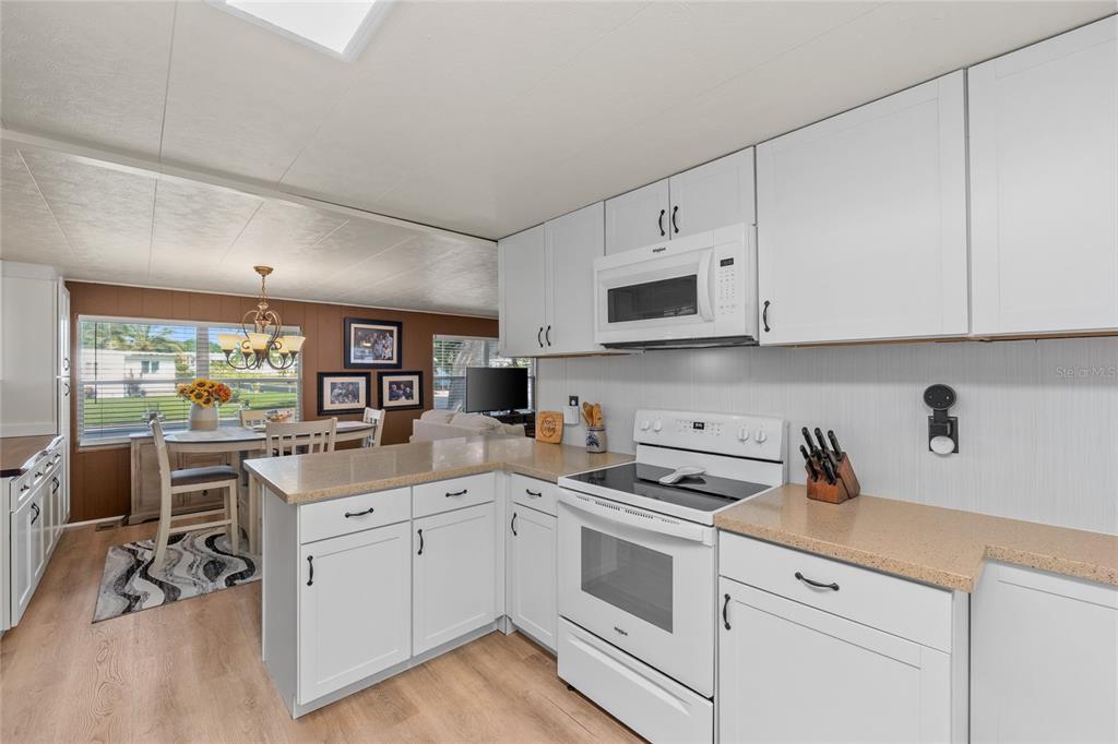 UPDATED KITCHEN WITH CORIAN COUNTERTOPS & WHIRLPOOL APPLIANCES (2021) and lots of storage
