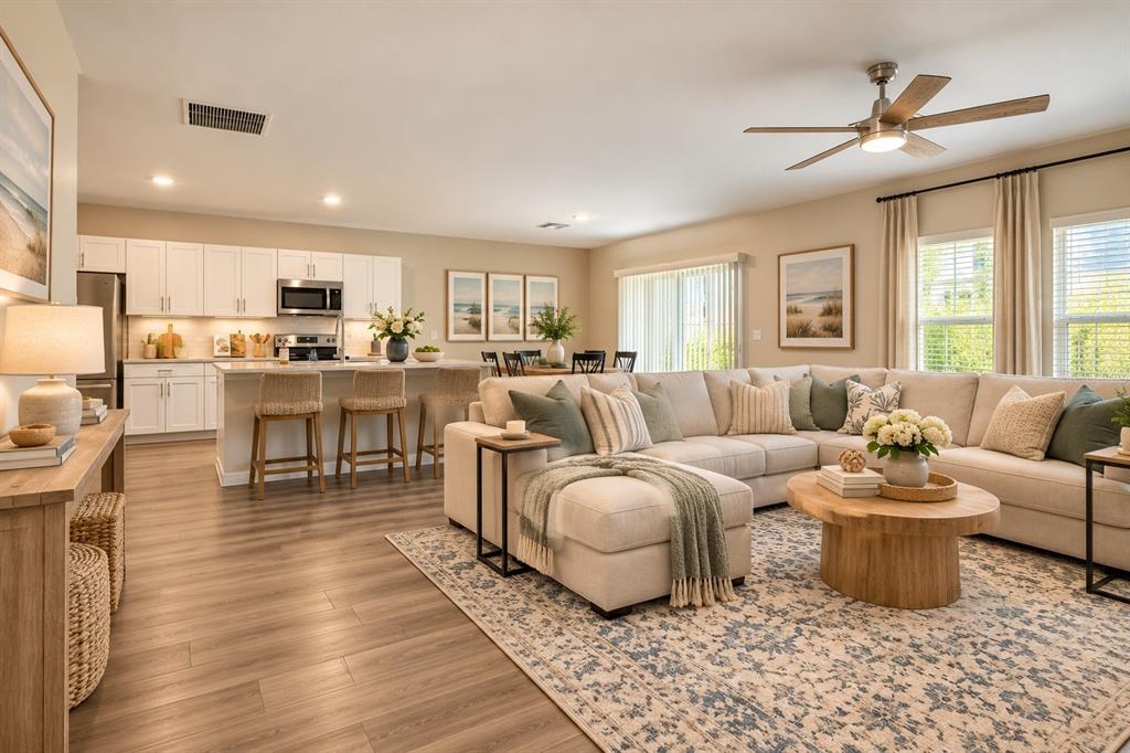 Open Concept kitchen/Family room digitally staged