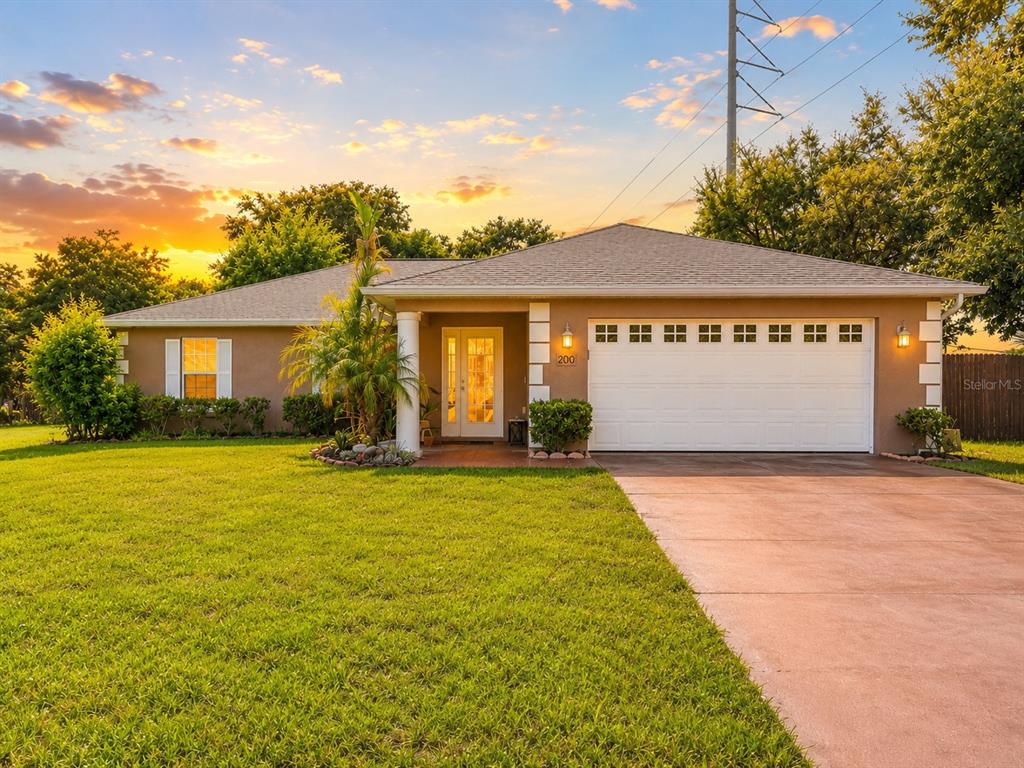 Exterior front of home. Located on just under 1/2 acre, fully fenced backyard, and large detached 2 car garage