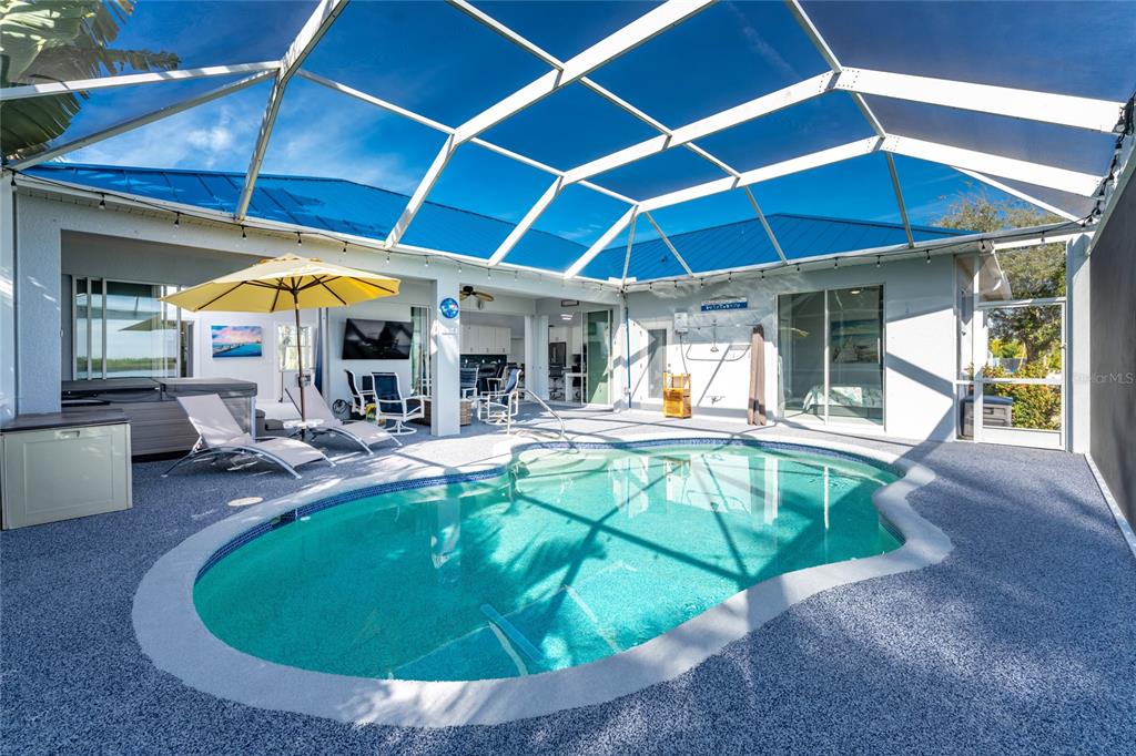 New EPDM rubber coated pool deck.  Soft on your feet and won't burn them!