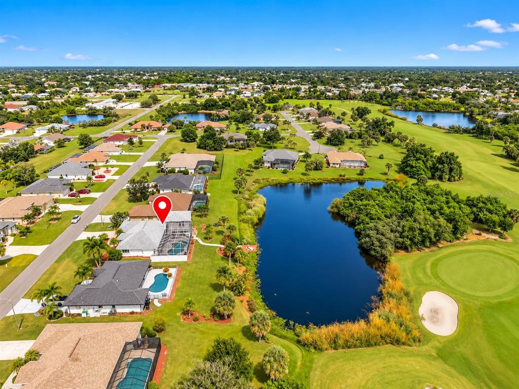4. Aerial view of the surrounding neighborhood and ponds.