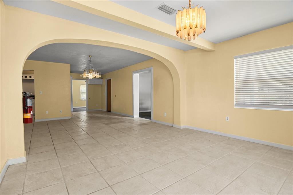 View of the living room and dining room from the front door.