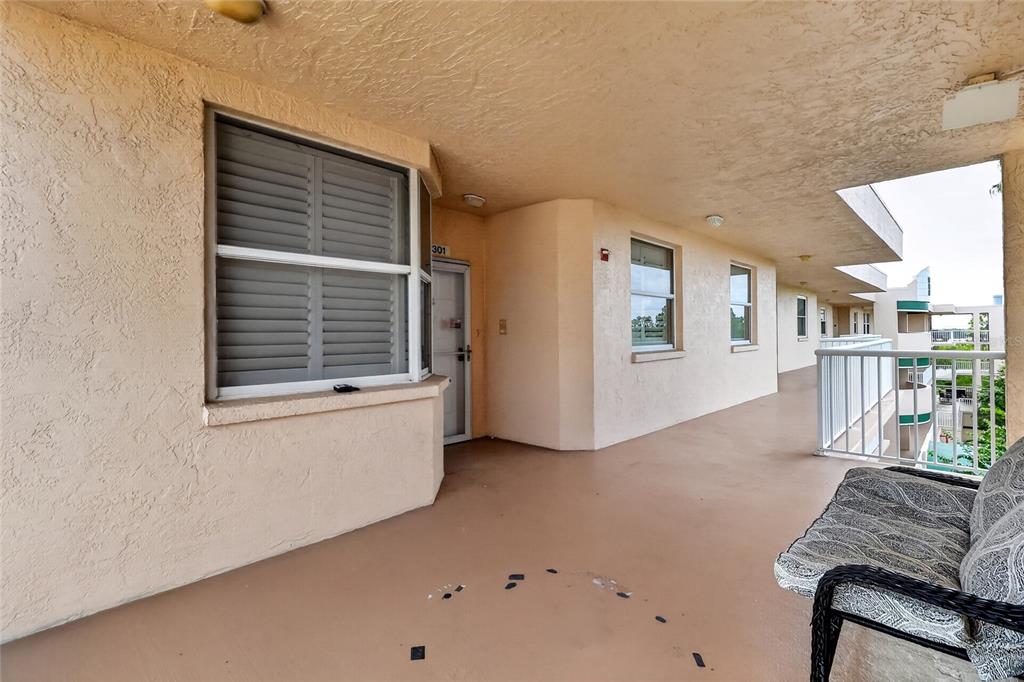 Front door to unit showing patio