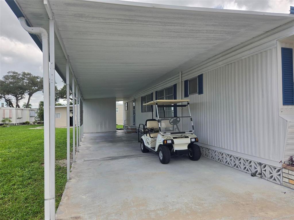 Large Carport with room for a car and golf cart