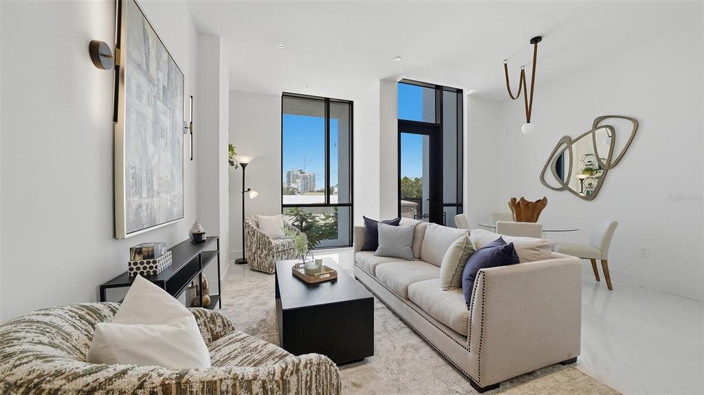 This cozy MOVE IN READY condo on the 2nd floor features two bedrooms, two baths and an open floor plan with tons of light provided by hurricane insulated glass.