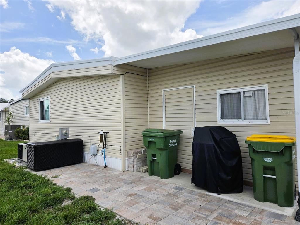 Back of home with paver walkway
