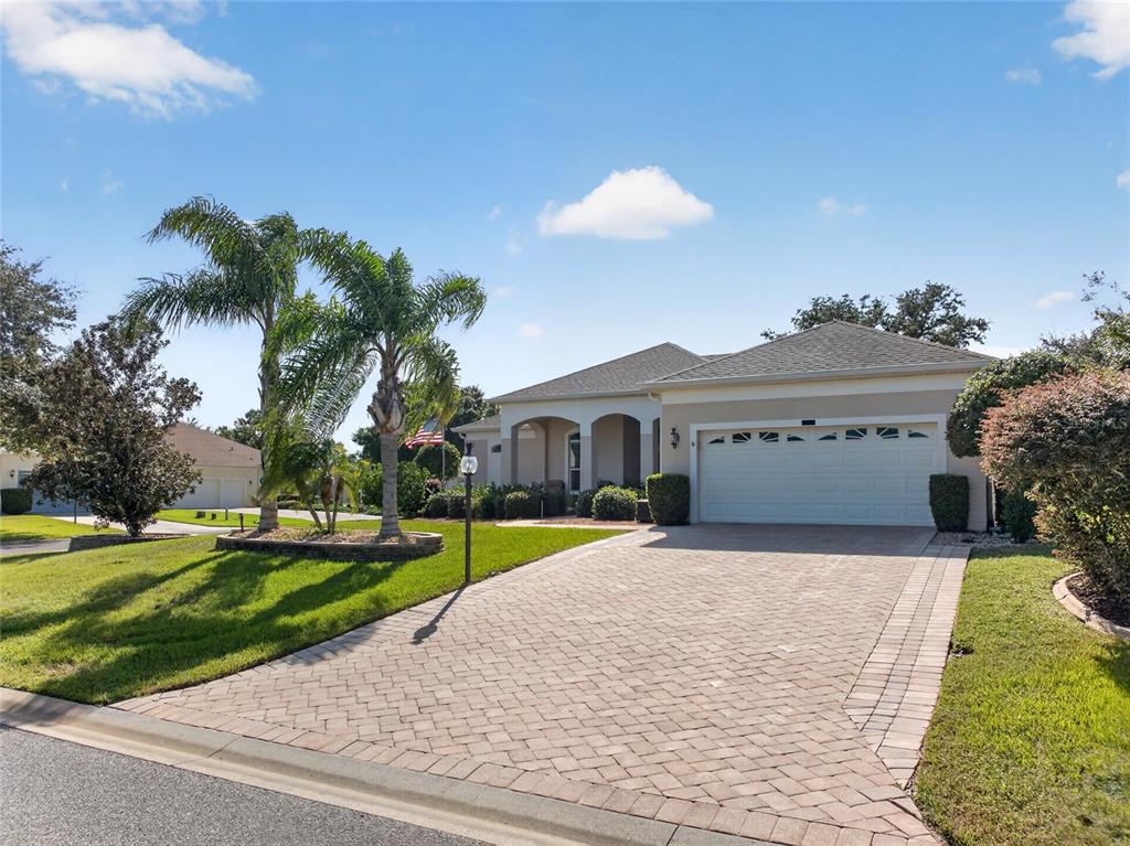 SHE IS A BEAUTY. CORNER LOT, PALM TREES, BRICK PAVER DRIVEWAY