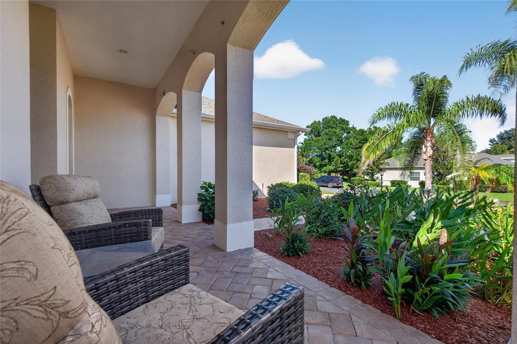 FRONT COVERED PORCH WITH.  COFFE HERE IN THE MORNING AND YOU CAN CATCH A GLIMPSE OF A POND.