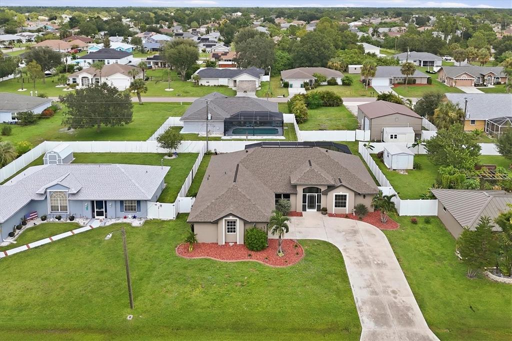 front aerial photo shed and garage on lot to right behind is included in sale