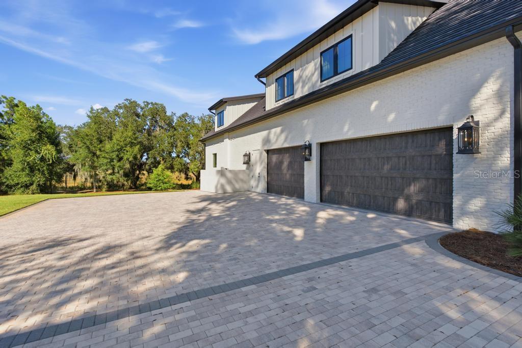Room for all your cars and toys  with extra brick paver driveway