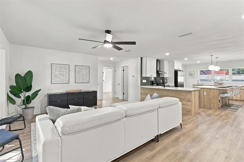 Step inside to a welcoming living room that flows seamlessly into the beautifully updated kitchen, creating an inviting and functional space perfect for everyday living and entertaining.