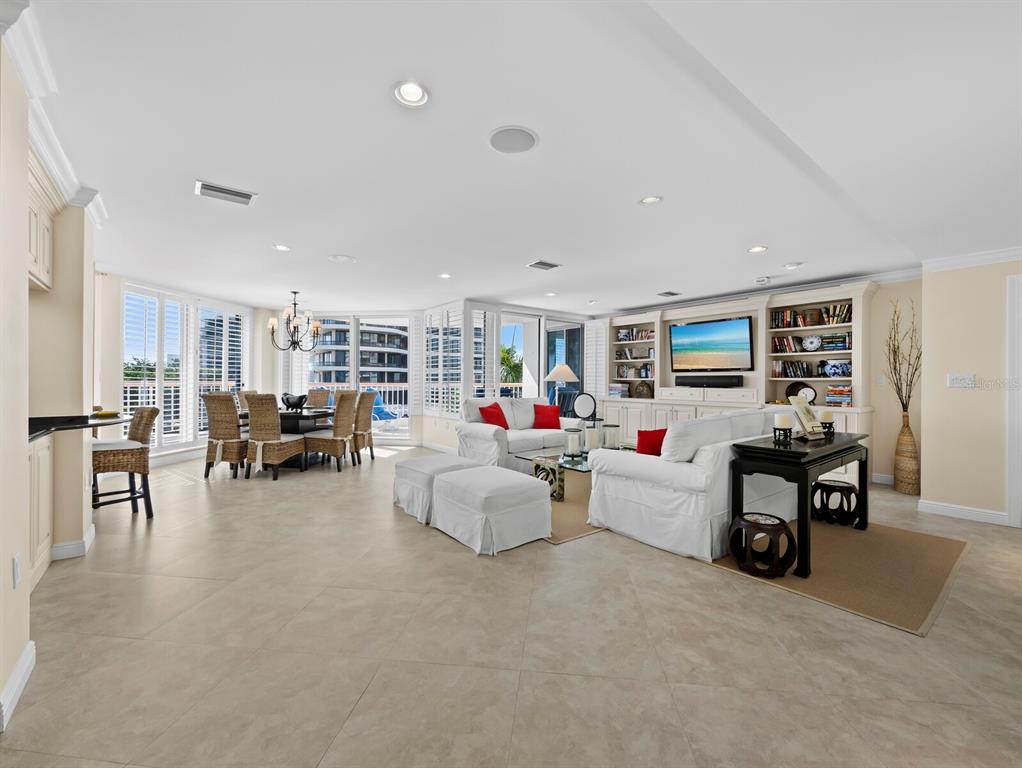High ceilings, open floor plan, floor-to-ceiling windows optimize the light and views.  Enjoy sunset Gulf views to the west and sparkling city views to the east at night.