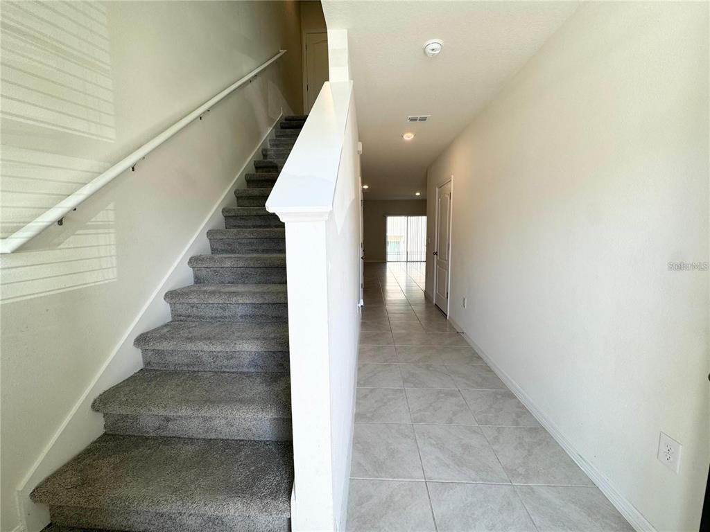 View toward second story, breezeway and closet.