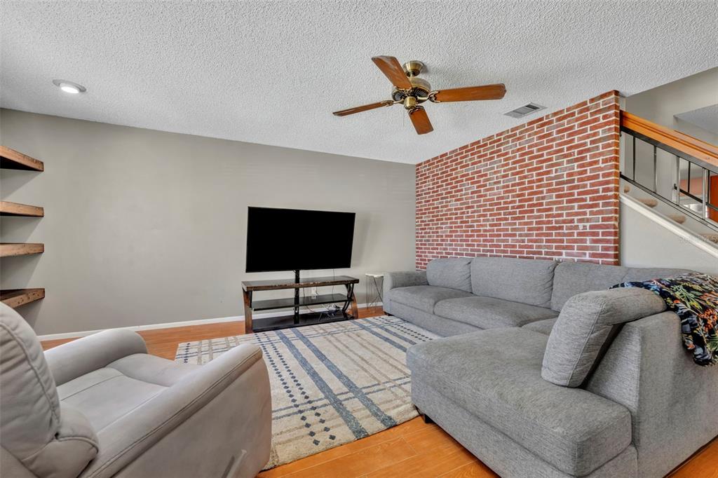 A real red brick accent wall welcomes you when you first enter.