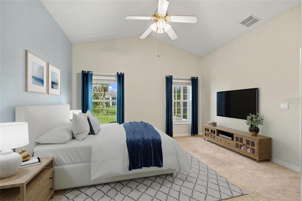 Virtually staged primary en suite bedroom in back of house