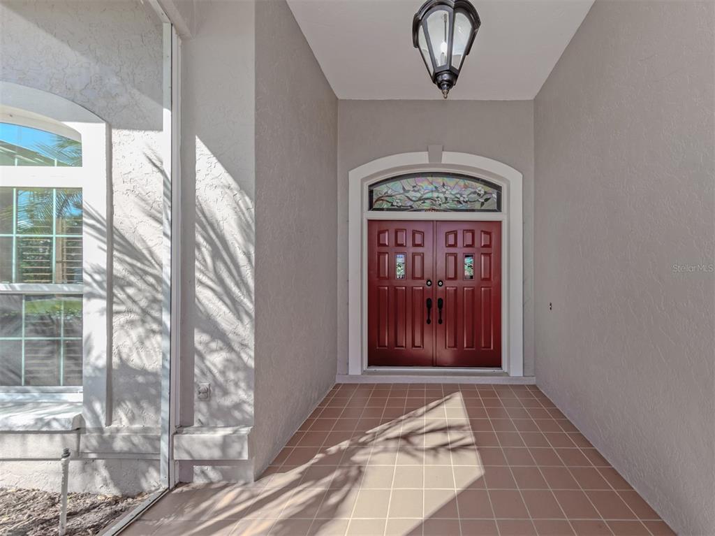 The large screened entry is perfect to welcome guests