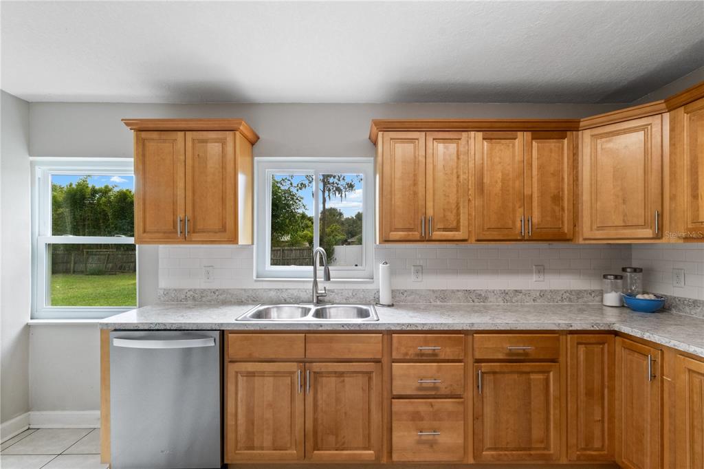 Kitchen with view of backyard