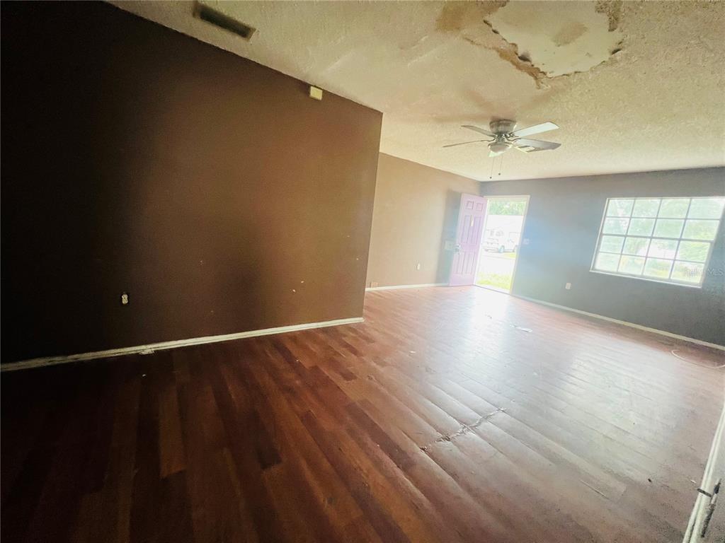 VIEW FROM KITCHEN TO DINING AND LIVING AREA