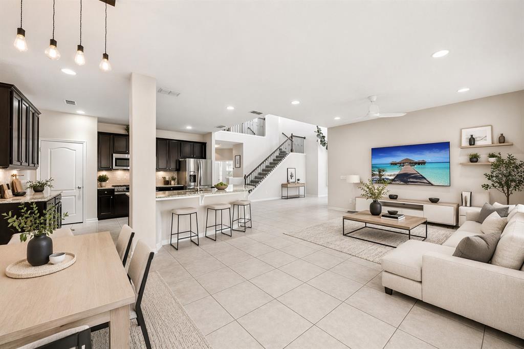 Virtually staged great room open to the kitchen
