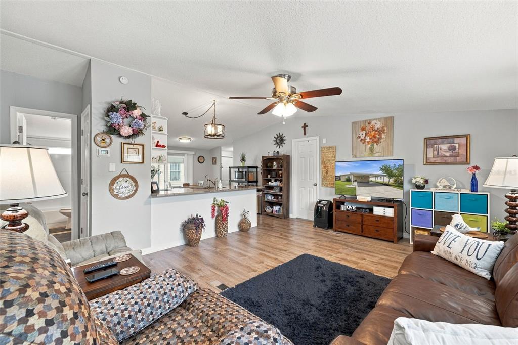 Large family room just off the kitchen!  Life Proof Laminate flooring throughout most of the home, including the kitchen, family room and 2 out of 3 bedrooms! Bright open floor plan with updated lighting and fresh paint!